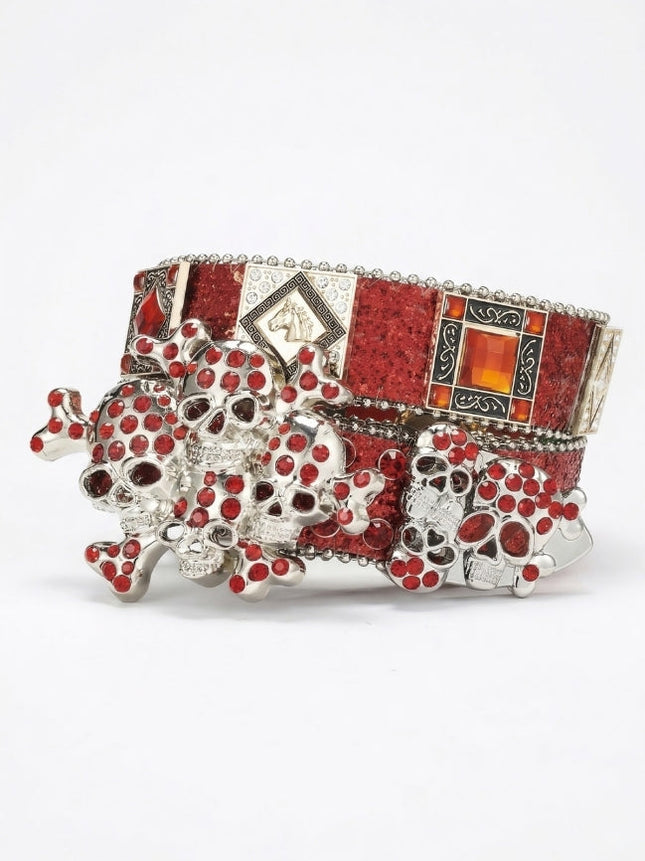 Decorative bracelet with red stones and silver accents on a white background