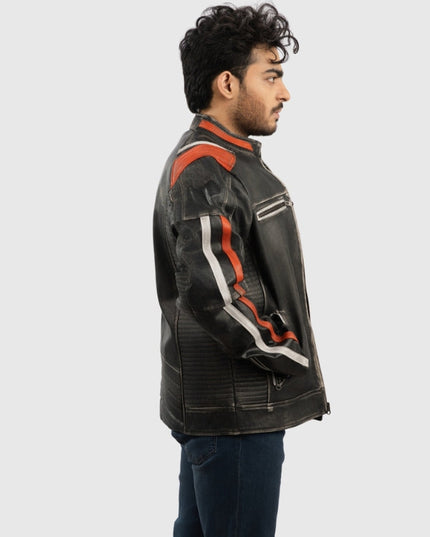 Man wearing a black leather jacket with orange and white accents on a light gray background