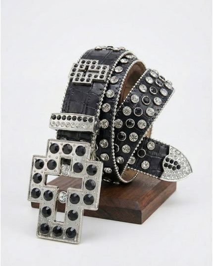 Black belt with silver studs on a wooden stand against a white background