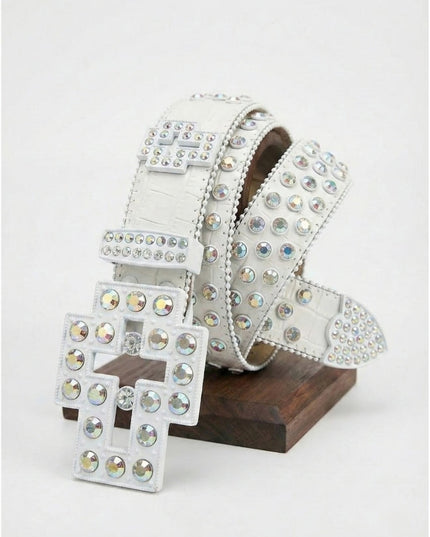 Silver belt with rhinestone embellishments on a wooden stand against a white background