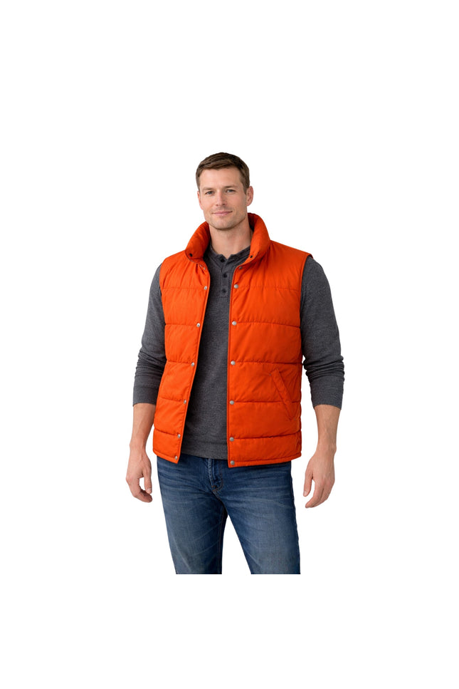 Man wearing an orange puffer vest over a gray shirt on a white background