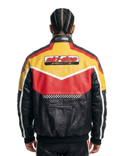 Person wearing a colorful racing jacket with 'Ski-Doo Racing' logo on a white background