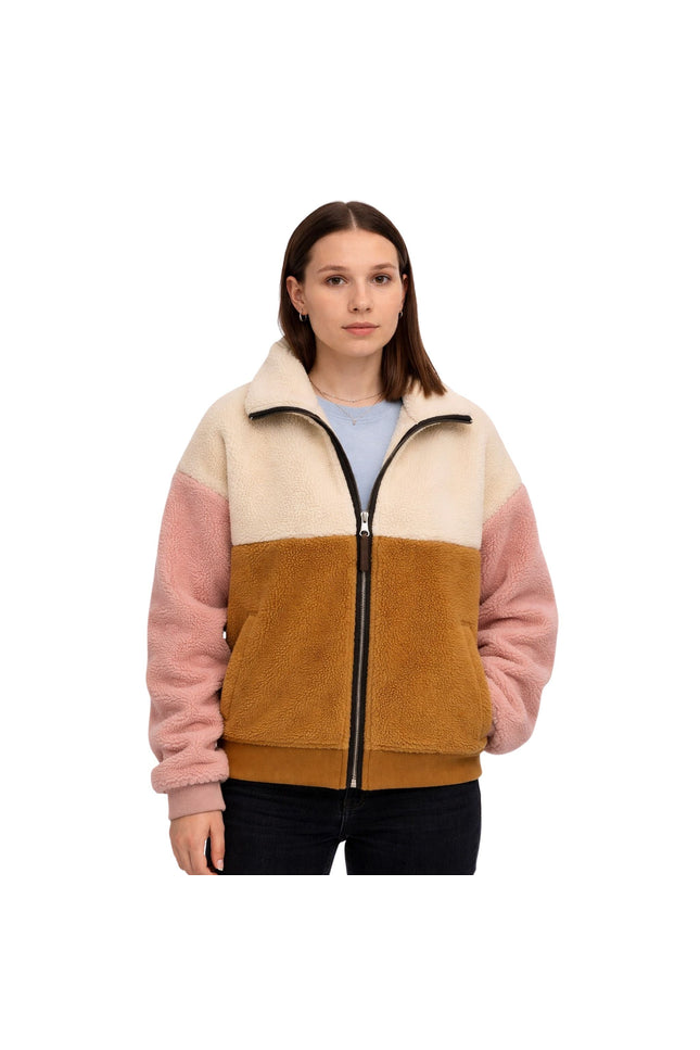 Woman wearing a multicolored fleece jacket on a white background