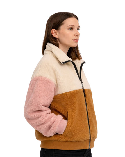 Woman wearing a color-blocked fleece jacket with beige, pink, and brown sections on a white background.