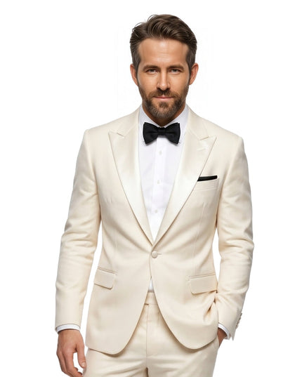 Man wearing a white tuxedo with a black bow tie on a white background
