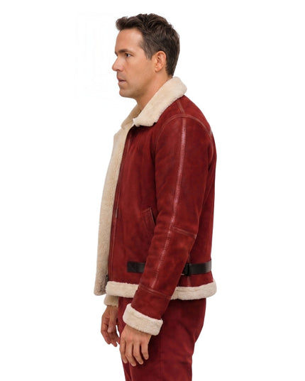 Man wearing a red suede jacket with white fur lining on a white background