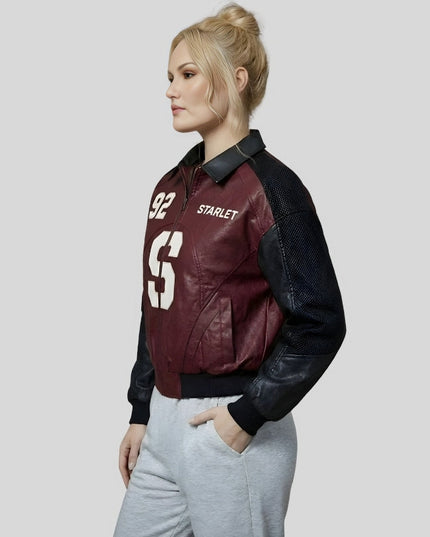 Person wearing a maroon and black bomber jacket with 'Starlet' branding on a light gray background