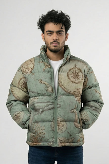 Man wearing a puffer jacket with a map design on a plain background