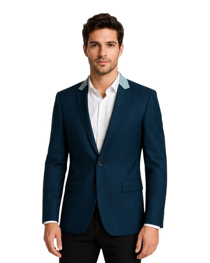 Man wearing a blue suit jacket with white shirt on a white background