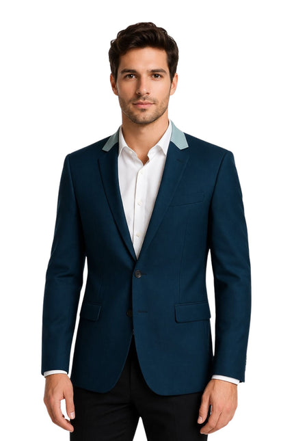 Man wearing a blue suit jacket with white shirt on a white background