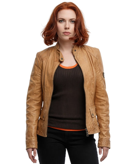 Woman wearing a tan leather jacket on a white background