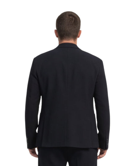 Black suit jacket worn by a person on a white background