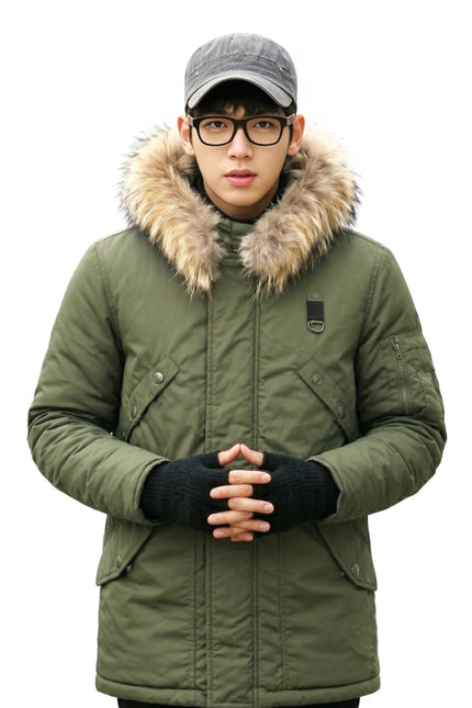 Person wearing a green winter coat with fur hood on a white background