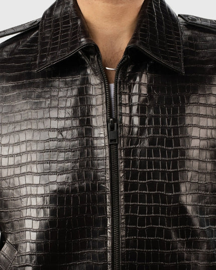 Close-up of a black textured jacket with a zipper