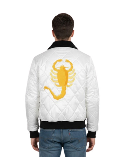 White quilted jacket with yellow scorpion design on the back, worn by a person.