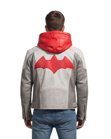 Person wearing a gray jacket with a red bat symbol on the back against a white background