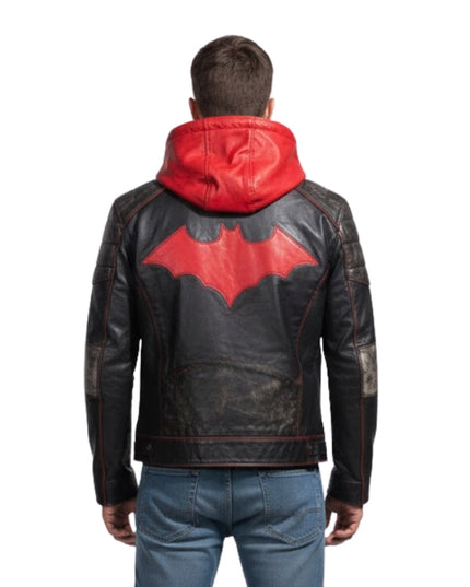 Person wearing a black leather jacket with a red bat symbol on the back, on a white background