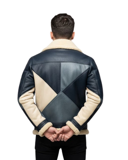 Man wearing a black and beige quilted leather jacket on a white background