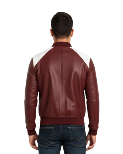 Man wearing a maroon leather jacket with white sleeves on a white background