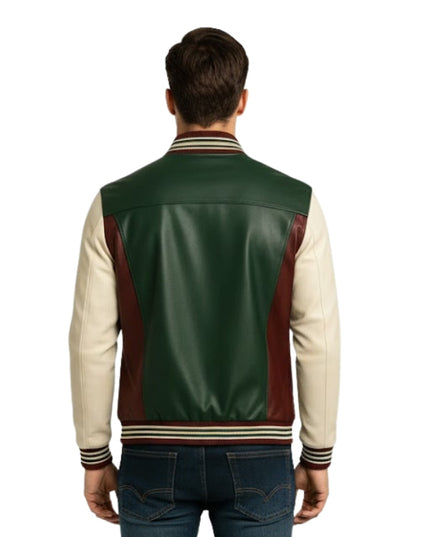 Man wearing a green, red, and beige varsity jacket on a white background