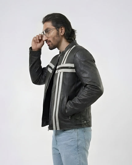 Man wearing a black leather jacket with white stripes on a white background