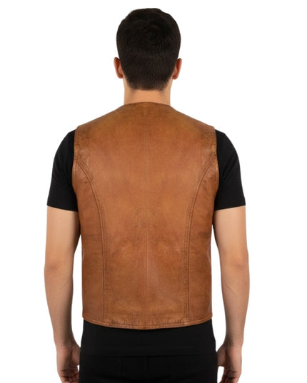 Man wearing a brown leather vest over a black shirt on a white background