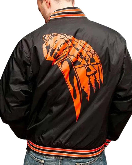 Black jacket with orange panther design on the back, worn by a person.