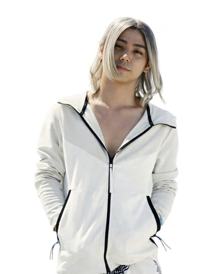 Person wearing a white zip-up hoodie with black trim on a white background