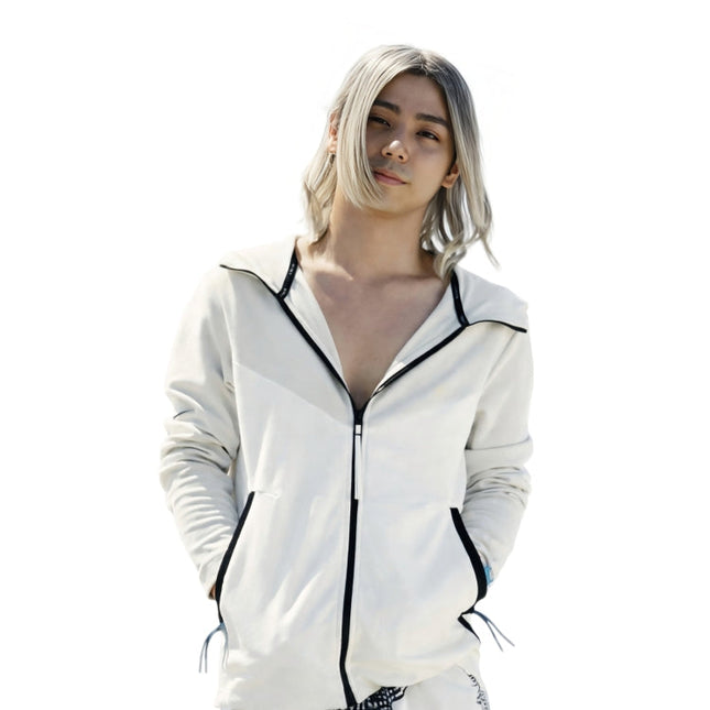 Person wearing a white zip-up hoodie with black trim on a white background
