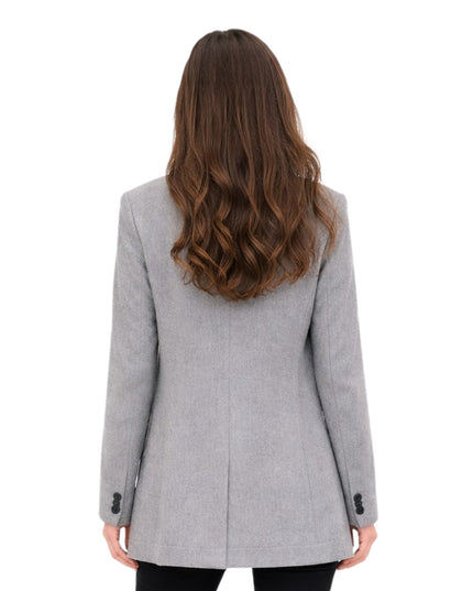 Woman wearing a gray coat from behind on a white background