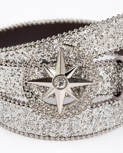 Silver belt buckle with star design on a glittery belt