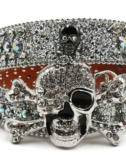 Silver skull belt buckle with rhinestones on a white background