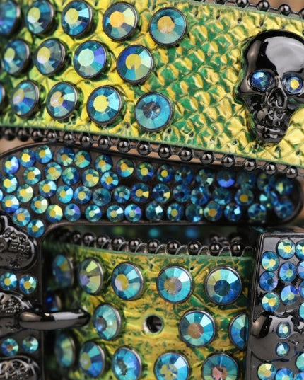 Decorative clutch with rhinestones and skull design on a green patterned background