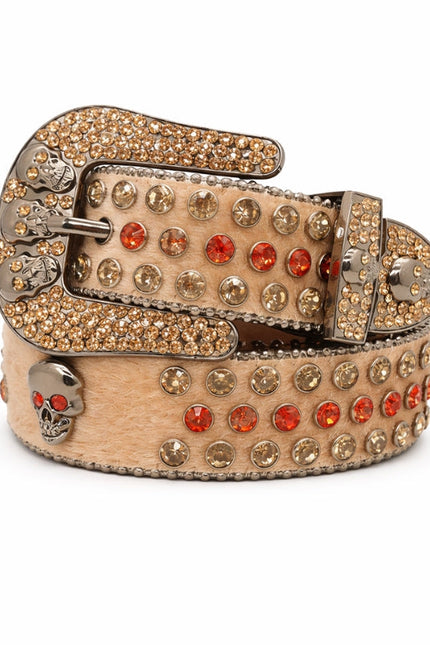 Decorative belt with gemstones and skull design on a white background