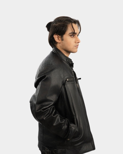 Person wearing a black leather jacket on a white background