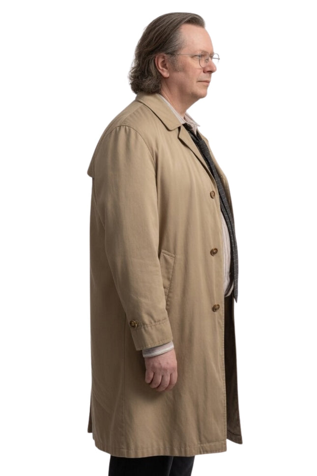 Man wearing a beige trench coat on a white background