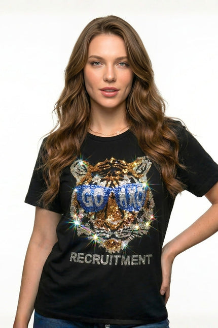 Woman wearing a black t-shirt with a tiger graphic and text on a white background