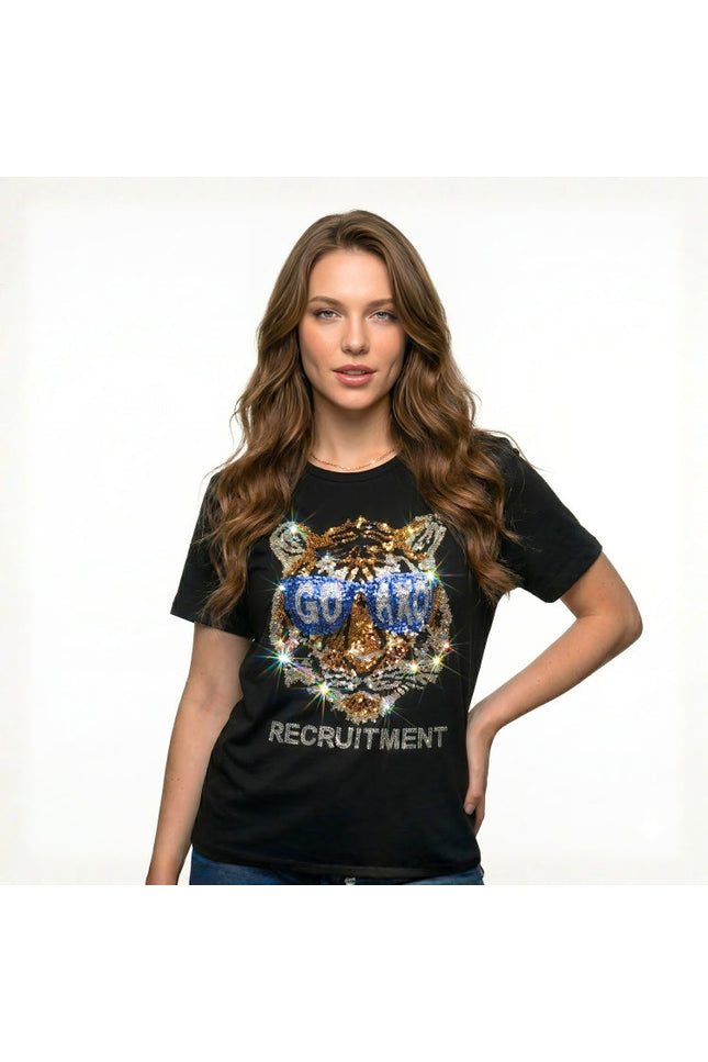 Woman wearing a black t-shirt with a tiger graphic and text on a white background