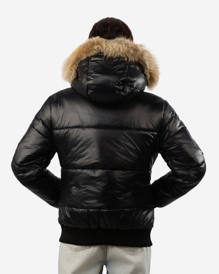 Black puffer jacket with fur hood on a white background
