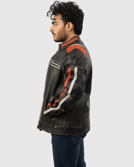 Man wearing a black leather jacket with red and white accents on a light gray background
