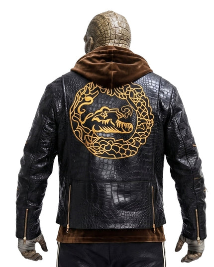 Black leather jacket with gold dragon design on the back, worn by a person.