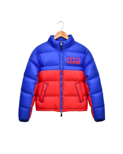 Blue and red puffer jacket on a hanger against a white background