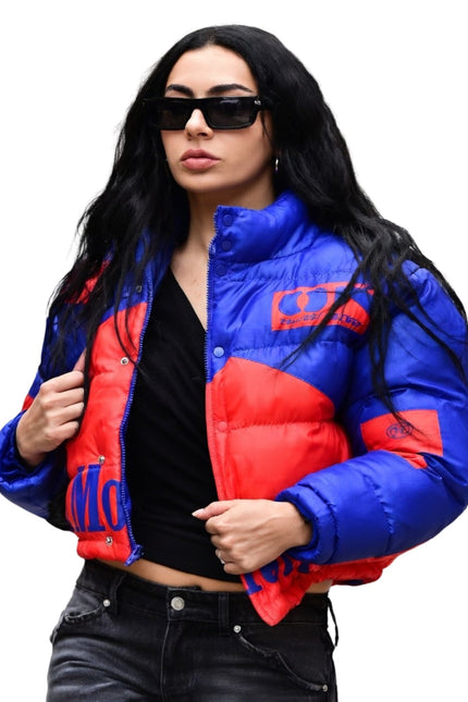 Woman wearing a blue and red puffer jacket on a white background