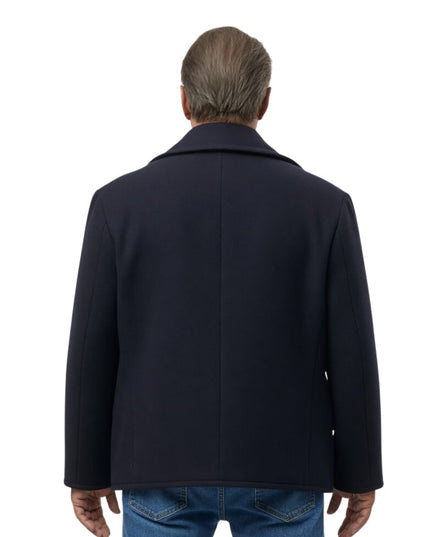 Person wearing a pink coat from behind on a white background