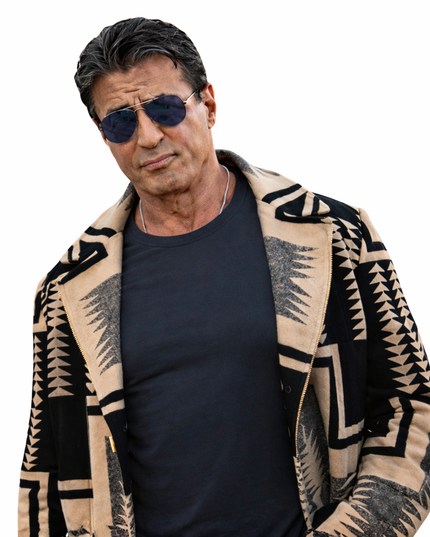 Man wearing a patterned cardigan over a dark shirt on a white background
