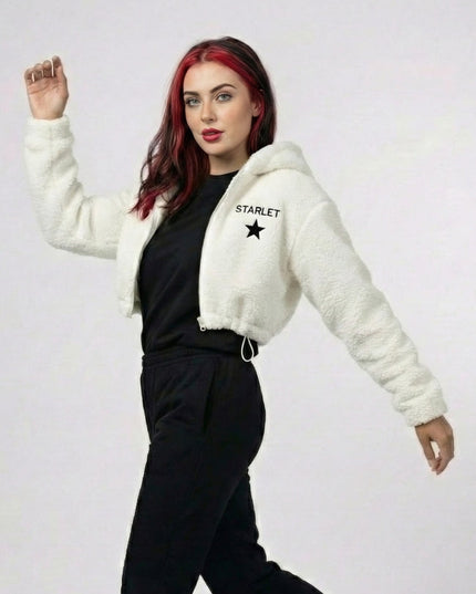 Woman wearing a white fleece jacket with 'Starlet' branding on a plain background