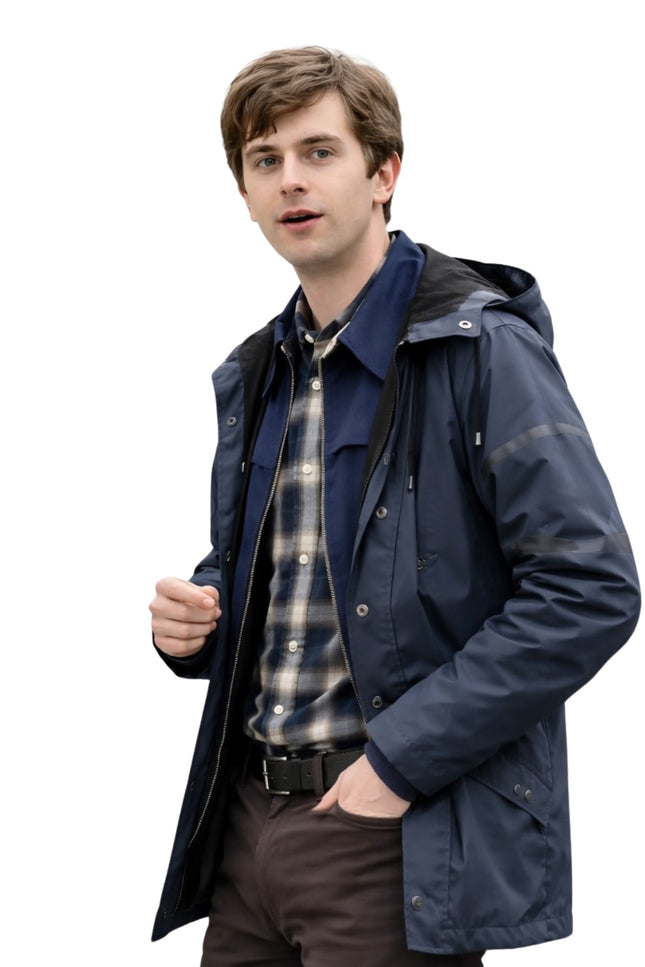 Man wearing a navy raincoat over a plaid shirt on a white background