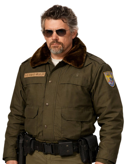 Person wearing a brown shearling collar bomber jacket on a white background
