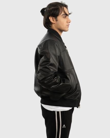 Person wearing a black leather jacket on a white background