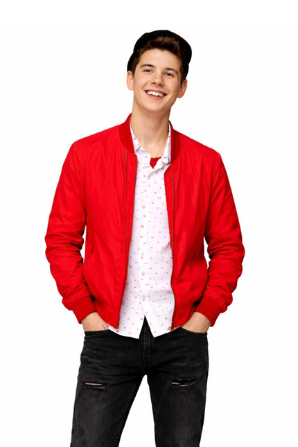 Person wearing a red jacket over a white shirt with black pants on a white background